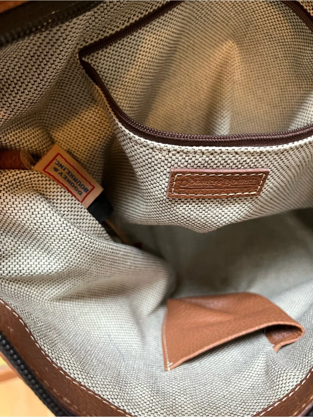 Dooney & Bourke Camel Brown Pebbled Leather Shoulder Bag with Tassel Emblem